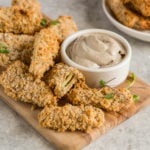 artichoke fries with mushroom aioli on wooden cutting board