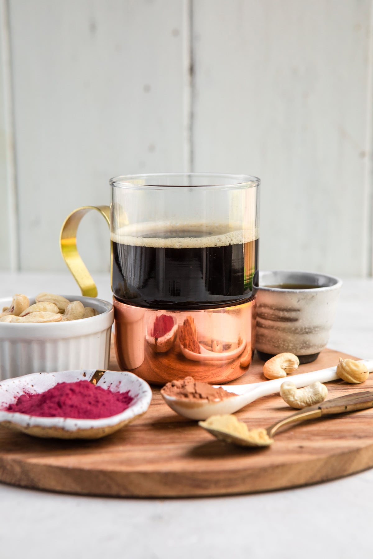 ingredients for beet latte on round wood cutting board
