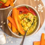 bowl of savory oatmeal on wood cutting board