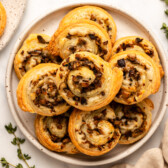 mushroom pinwheels stacked on white plate