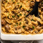 No Boil baked vegan mushroom stroganoff in white casserole dish topped with fresh parsley