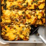 Vegan breakfast strata in casserole dish with sausage and kale