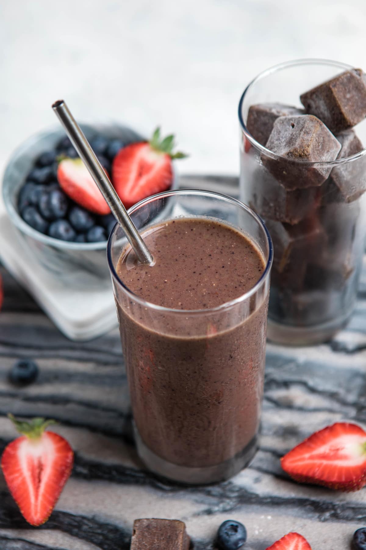 glass filled with blended superfood smoothie mix