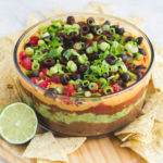 glass bowl of seven layer dip