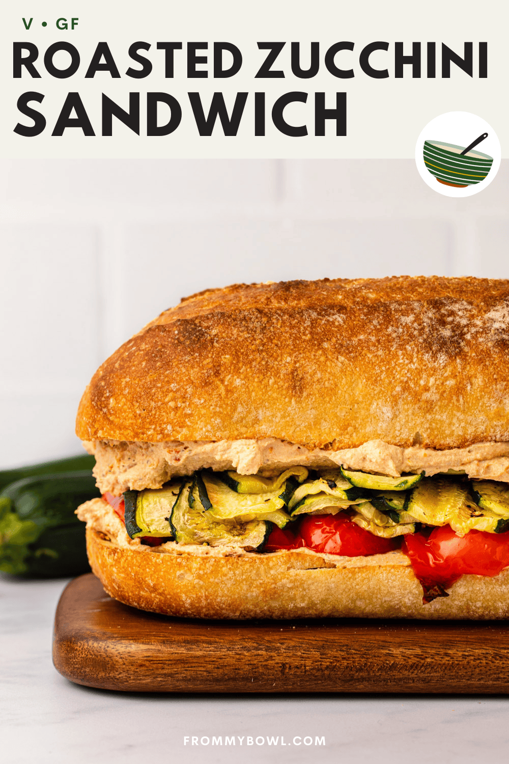 roasted zucchini sandwich served on a cutting board on a marble kitchen countertop