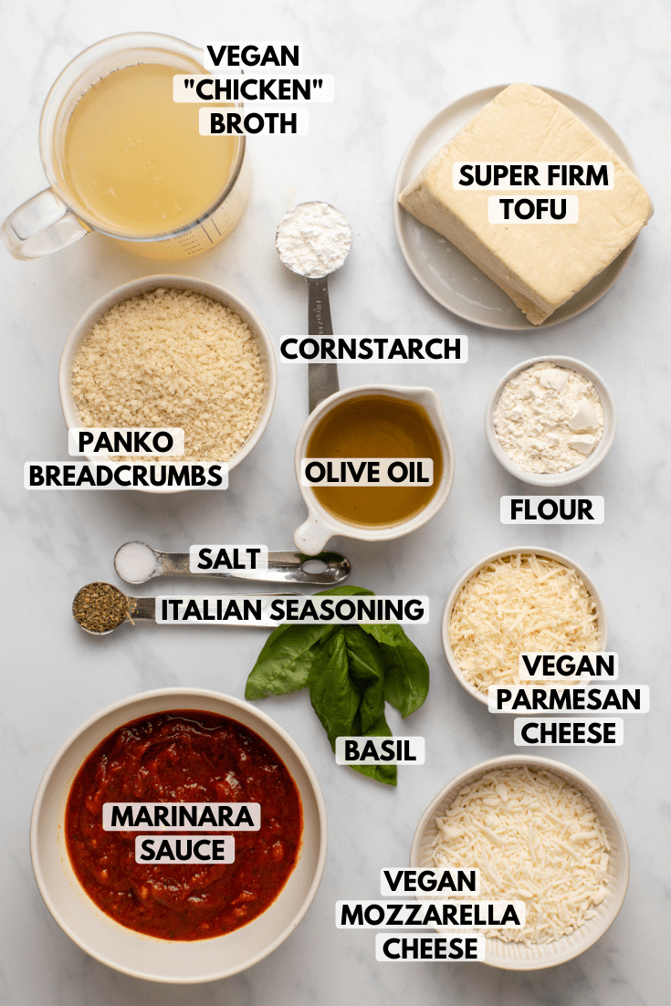 ingredients for tofu parmesan in small bowls on marble background