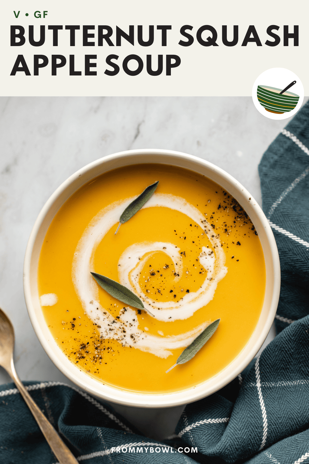 a bowl of butternut squash and apple soup in white bowl with marble background