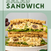 vegan chickpea salad sandwich sliced in half and stacked on white plate