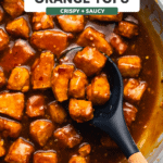 crispy orange tofu in pan with orange sauce