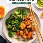 Orange tofu in bowl with white rice and broccoli