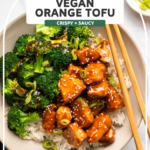 Orange tofu in bowl with white rice and broccoli
