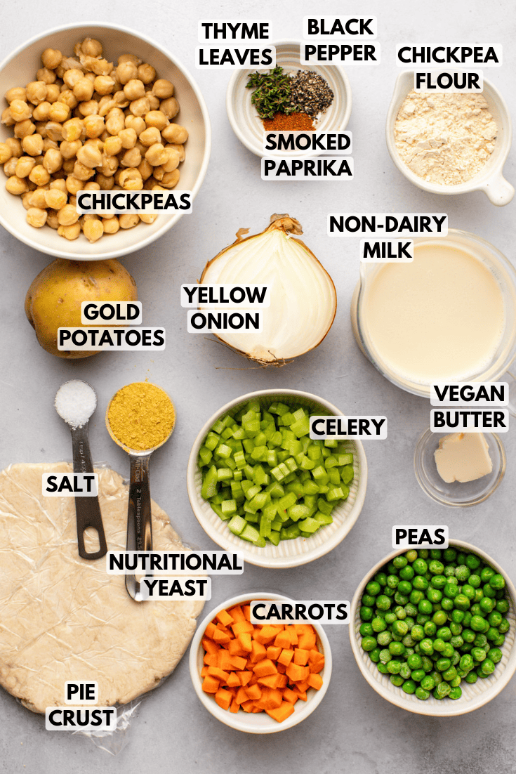 ingredients for vegan pot pie laid out on a marble kitchen countertop